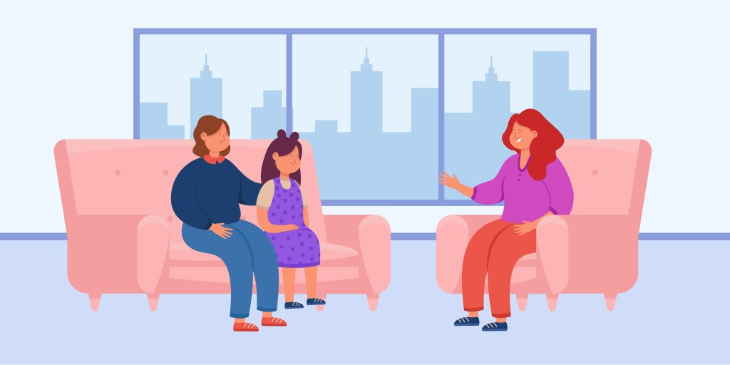 A therapist sitting on a pink chair, engaging with a child and a parent in a cozy room with large windows showing a cityscape.